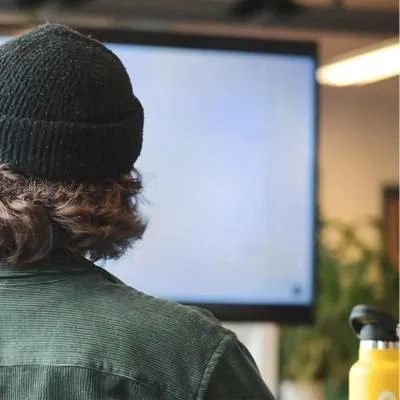 Man wearing a hat with water bottle